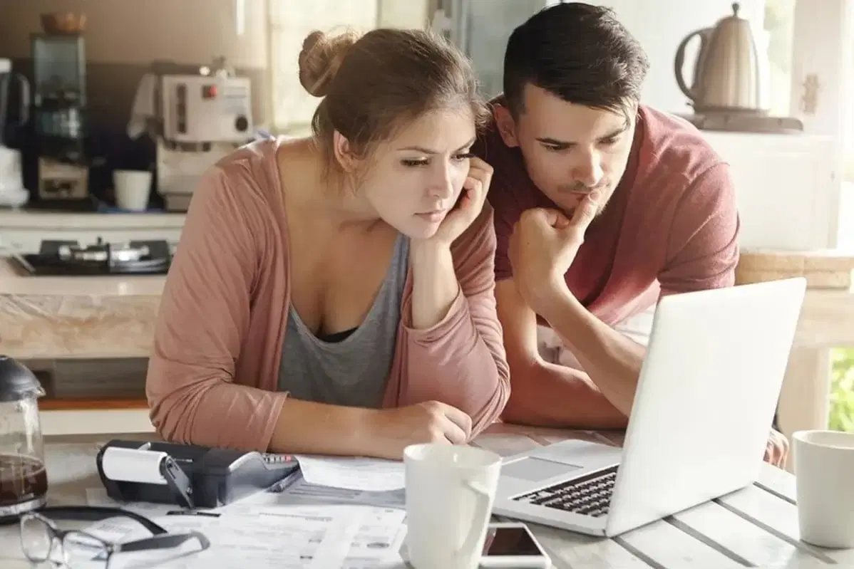 Serious man and woman sitting
