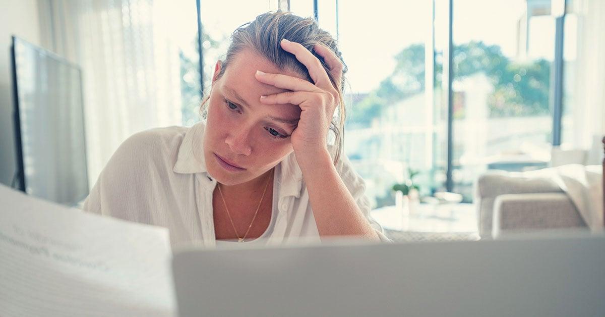 person-looking-at-bills-concerned