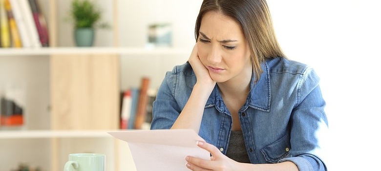 Woman looking stressed about debt consolidation loan