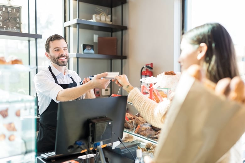 Woman making a store purchase with a card